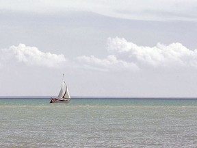 A sailboat skims across Lake Erie in Port Stanley on Sunday, May 26. Residents with docks and boats in Port Stanley are advised to keep an eye on local conditions and check the marine forecast for information on wave heights and wind speeds. (Derek Ruttan/Postmedia Network)