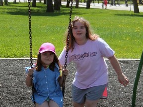 Sasha Rees, 5 and Aubrey Duckett, 10 loved being able to come to the playground again after the City of Wetaskiwin opened its playgrounds last week.