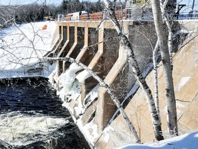 A jet of water plumes out from under OPG's Bark Lake Control Dam along the Madawaska River. RYAN PAULSEN