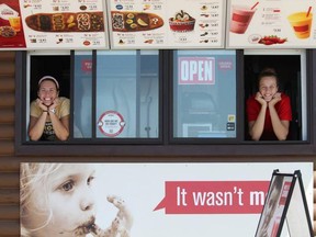 From left to right, Bridget Rusk and Alex Kiss-Rusk pose inside the BeaverTails at Sauble Beach take-out hut during its first season of operation. Photo supplied.