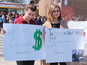 Maeve Stemp, left, and Mikaila Kimball hold signs at a rally last May at Chippewa Secondary School. Students across the province walked out of classes to oppose planned changes to the education system.
PJ Wilson/The Nugget
