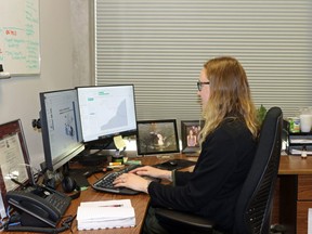 Melissa MacLeod, an epidemiologist with Southwestern public health, works on an information file that's part of their data dashboard. The information is used to inform the public on COVID-19 and help municipal and health care sectors with short- and long-term planning. (Greg Colgan/Sentinel-Review)