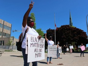Simone Tennant stands with others Monday outside Sarnia City Hall in support of Black Lives Matter demonstrations being held around the world.