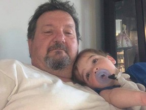 Darcy Krauza, pictured here with his grandson, was killed in a motorcycle crash in St. Thomas in May 16. The driver of the SUV that collided with Krauza has been charged, police said Tuesday. (Photo supplied by Chris Krauza)