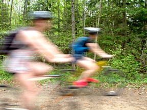 Cyclists take advantage of a nice day to ride the Cranberry Trail in Callander. 
Mackenzie Casalino