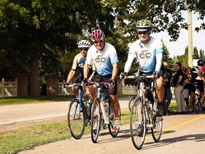 Joseph Sebben, Randy Perdu and Rand MacIntosh ride their bicycles along Phase 1 of the Round the River Recreational Trail along Grand Avenue West in Chatham in August 2019. Tom Morrison/Postmedia