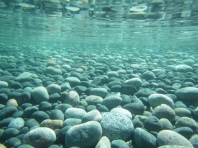 Clear waters reveal the rocky bottom of a Lake Superior shoreline at Montreal River Harbour. Ward Conway