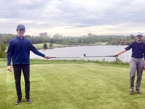 Lea Lemieux and Joseph Colasimone demonstrate their awareness of physical distancing on the 
golf course.