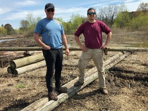 Phil Holst, left, and Alexander Innes stand with the posts as progress is being made on the latest project by the Woodstock Field Naturalists Club. The first of four Osprey platforms will be erected at the Brick Ponds in conjunction with the Ducks Unlimited project.

Photo courtesy of Richard Skevington