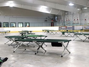 Beds are set up at Pete Palangio Arena, April 16, for the city's 24-7 emergency homeless shelter. 
Michael Lee/The Nugget