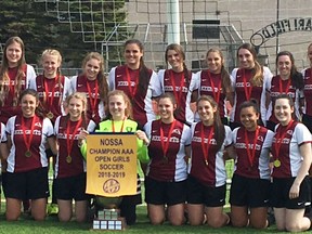 Members of the St. Mary's Knights celebrate the 2019 open girls NOSSA soccer championship