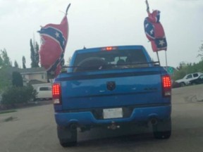 On Sunday, May 31, a blue pickup truck was spotted driving around Sherwood Park with two large confederate flags flying on each side of the vehicle. Photo via Facebook