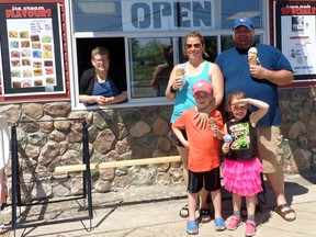 The Hopkins family enjoys an ice-cream break. Mom Shelly goes for the chocolate caramel cup, while dad, Tim, has a triple-decker of strawberries and cream, tiger tail and chocolate chili. Meanwhile, Holden has the chocolate fudge brownie and Isla opts for cotton candy. Elizabeth Creith