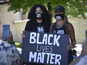 Organizers Hannah Hodder and Jessica Hoffstetter pose for a photo at Sunday’s Black Lives Matter protest at Victoria Park in Woodstock.  (Kathleen Saylors/Woodstock-Sentinel-Review)
