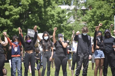 Protesters joined hands in solidarity on Sunday for a Black Lives Matter protest. (Kathleen Saylors/Woodstock-Sentinel-Review)