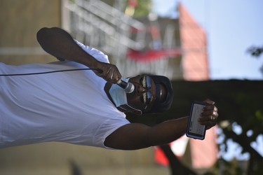 Rohan Morgan sings to the crowd at Sunday’s Black Lives Matter in Woodstock. Hundreds of people attended the peaceful demonstration. (Kathleen Saylors/Woodstock-Sentinel-Review)