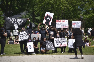 Protesters paused for a photo at Sunday’s Black Lives Matter protest in Woodstock. (Kathleen Saylors/Woodstock-Sentinel-Review)