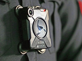 A Calgary Police staff sergeant wears one of the service's body cameras. Kingston Police are considering purchasing body cameras. (Gavin Young/Postmedia Network)
