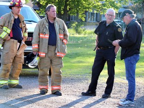 Sault Ste. Marie Fire Services investigates a fire at St. Paul Catholic elementary school, 78 Dablon St., in Sault Ste. Marie, Ont., on Tuesday, June 9, 2020. Platoon chief Jeff Lajoie and fire prevention officer Dan Fraser speak with Steve Brown of Huron-Superior Catholic District School Board. (BRIAN KELLY/THE SAULT STAR/POSTMEDIA NETWORK)