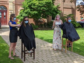 Norfolk Mayor Kristal Chopp and Haldimand Mayor Ken Hewitt got haircuts on the steps of Governor Simcoe Square on Tuesday as a protest against the counties being held back from Stage 2 of the province’s reopening plans this Friday. Submitted photo