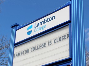 A sign advising the public Lambton College is closed due to the COVID-19 pandemic, on April 11, 2020. Terry Bridge/Postmedia Network