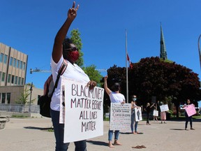 Simone Tennant stands with others outside Sarnia City Hall in support of Black Lives Matter demonstrations being held around the world. Paul Morden/Postmedia Network