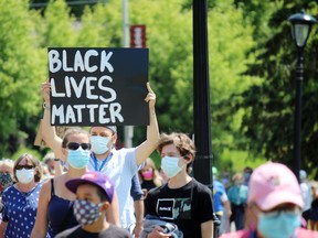 Kenora residents turned out in droves with placards during a memorial service for George Floyd, a 45-year-old Minneapolis Minn., black man who died in police custody. Floyd's death has sparked rallies across North America, including the one held in Kenora on Monday.