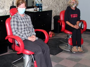 Sue Baribeau and Ingrid Strobel are getting ready to reopen JD Barber Shop and Hair Styling Friday.
PJ Wilson/The Nugget