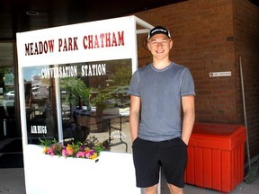 Jonny Vanek, a Grade 11 student at Lambton Kent Composite School in Dresden, is shown next to one of two "conversation stations" he built for Meadow Park Long-Term Care Home in Chatham to allow residents to meet with family members while practising social distancing. (Handout)
