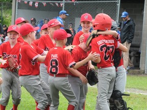Members of the Brockville Braves Little League minor team celebrate a win early last summer. The league is hoping to hold workouts for travel team players next week. (FILE PHOTO)