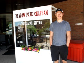 Jonny Vanek, a Grade 11 student at Lambton Kent Composite School in Dresden, is shown next to one of two "conversation stations" he built for Meadow Park Long-Term Care Home in Chatham to allow residents to meet with family members while practising social distancing. Handout/Postmedia Network