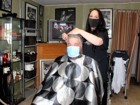 Carrie Hinds, owner of the Barbershopgirl in Chatham, was cutting the hair of Scott Bennett on June 12, the first day of Stage 2 reopening across many parts of Ontario. Ellwood Shreve/Postmedia Network