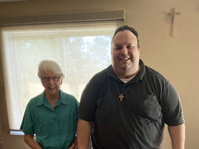 Rev. Peter Ciallella, pastor at Blessed Sacrament Parish in Burford, and long-time parishioner Kathy Kunkel are helping assemble gift bags for migrant farm workers from Norfolk County who are quarantined in Brantford hotels. Submitted