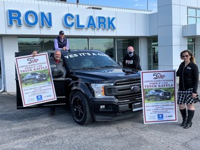 Lambton Elderly Outreach has teamed up with Ron Clark Motors to hold a weekly virtual bingo game that promotes local businesses and staves off isolation for local residents. The dealership has also provided the pictured Ford F-150 for a 50th anniversary raffle for LEO, which also benefits local chapters of the Kidney Foundation of Canada and the Multiple Sclerosis Society. From left are LEO CEO Bill Yurchuk, Ron Clark Motors’ J.D. Power, Jay Mackay and Laura Domingos. Handout/Sarnia This Week