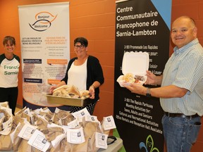 The Centre communautaire francophone de Sarnia-Lambton received a $9,000 Emergency Community Support Fund grant on June 11, federal money approved by the board of directors of the Sarnia-Lambton United Way to help support their COVID-19 meal program. From are Centre communautaire francophone de Sarnia-Lambton’s Tanya Tamilio, United Way of Sarnia-Lambton board of director labour representative Michele LaLonge-Davey and United Way of Sarnia-Lambton executive director Dave Brown. Carl Hnatyshyn/Sarnia This Week