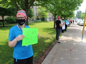 Leslie Geddes joins OPSEU members and supporters in a noon hour demonstration outside Bluewater Health in Sarnia on June 10, calling on the provincial government to extended its pandemic pay premium to OPSEU members in front line health care jobs. Paul Morden/Postmedia Network