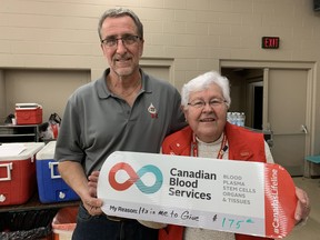Wallaceburg's Randy VanDorsselaer (left) holds up a sign with Canadian Blood Services volunteer Elsie Stratton to recognize his 175th time donating blood, during the Jan. 21 blood donor clinic held at the UAW Hall. File photo/Jake Romphf