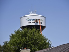The Oxford County water tower in Thamesford got a new look Wednesday. Painters put the finishing touches on a new paint job, including the addition of Oxford County's branding, after a report last year identified it was time for a new coat on the tower. (Kathleen Saylors/Woodstock Sentinel-Review)