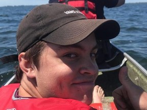 Brendan Hunter gives the thumbs up to Erik Olejnik as they help police and fire rescue two canoeists who capsized on Rondeau Bay on Monday, June 15, 2020. (Contributed Photo)
