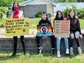 Sagamok youth, Acadia Solomon, Tobias Gegwetch, Rivata Toulouse, and Nyssa Solomon holding signs at Massey protest.
Photo by Leslie Knibbs/For The Mid-North Monitor
