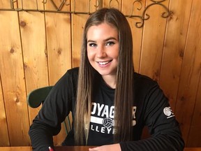 Starr Schott signs her letter of intent to play with the Rainy River Community College Voyageurs next season.