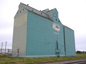 The Sexsmith grain elevator is partially repainted as part of its restoration in Sexsmith, Alta. on Saturday, June 13, 2020.