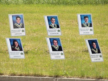 The school made signs for graduating students at their drive-thru ceremony Tuesday. Those interested can then take them home as a keepsake.