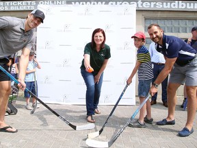 Danica Pagnutti, advisor in corporate and Indigenous affairs for Vale’s Ontario operations, drops a puck for NHLers Marcus Foligno and Nick Foligno, as well as NEO Kids patient Andrew McIntyre, outside Sudbury Community Arena in Sudbury, Ontario on Wednesday, July 10, 2019 at a press conference announcing that year's Vale Presents: NHL vs. Docs for NEO Kids fundraiser.