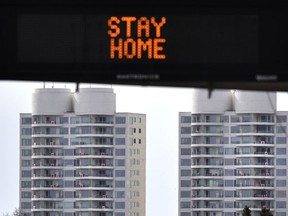 Canadian flags on the balconies of the 19 storey Riverwind Condos on Edmonton's Saskatchewan Dr., to show solidarity for the COVID-19 battle. This past weekend saw one new COVID-19 case emerge in Sherwood Park. ED KAISER/Postmedia