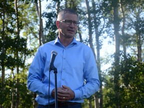 Alberta Finance Minister Travis Toews, who is also MLA of Grande Prairie-Wapiti, hosts an outdoor town hall for his constituents on a rural property north of Bezanson, Alta. on Friday, June 19, 2020.