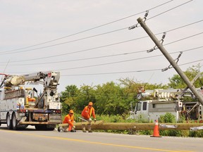 This Hydro One crew replaced a pole on Blue Line Road near Highway 3 Monday after a motorist lost control and ran into it. Norfolk OPP report minor injuries in the single-vehicle mishap. – Monte Sonnenberg photo