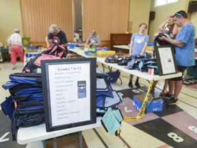 The 2019-2020 campaign - separated by grades, the backpacks and supplies, along with a new water bottle, are ready to be picked up by local families as part of the free Backpack Campaign, initiated by the Social Issues Networking Group at Crossroads United Church in Kingston, Ont. on Wednesday August 15, 2018. Julia McKay/The Whig-Standard/Postmedia Network