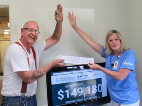 Blenheim resident Bert Vanderheide is congratulated last year by by Chatham-Kent Health Alliance Foundation president and CEO Mary Lou Crowley for winning the record $149,180 jackpot from the 50/50 draw the foundation held to raise money for new equipment to bring back the urology department to the Health Alliance. This year's draw will be held Aug. 26. File photo/Postmedia Network