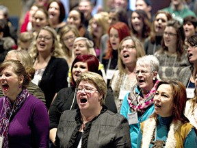 Singing and dancing in outdoor areas of restaurants, bars, food trucks or any similar establishment will constitute a violation of Ontario’s Emergency Management and Civil Protection Act, it was revealed June 16. As for churches, singing is being discouraged. File photo shows singing church members in Edmonton in 2013. File photo/Postmedia Network